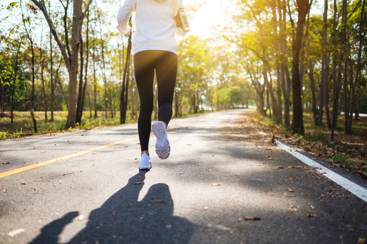 Rear-view shot of a young woman jogging.